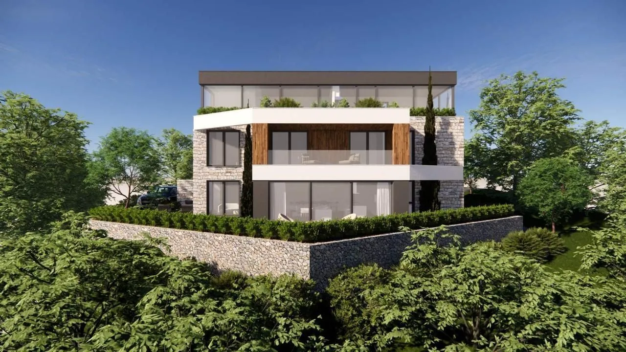 Pogled na prednju fasadu moderne stambene zgrade okružene zelenilom.