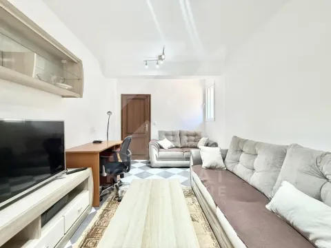 Living room with sofa, TV and desk. - image 2
