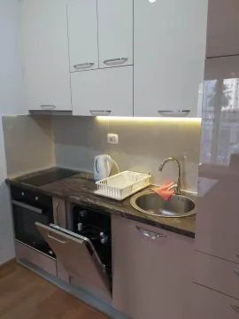Modern and functional kitchen with built-in appliances. - image 8