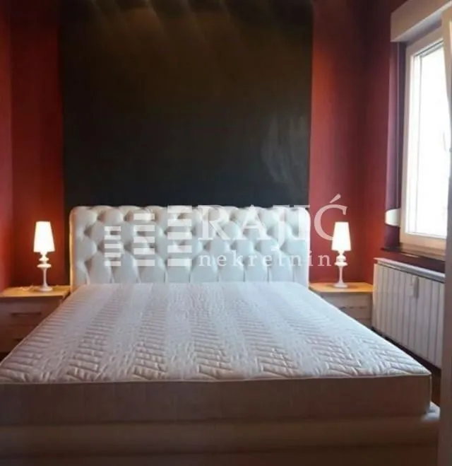Bedroom with a double bed and nightstands.