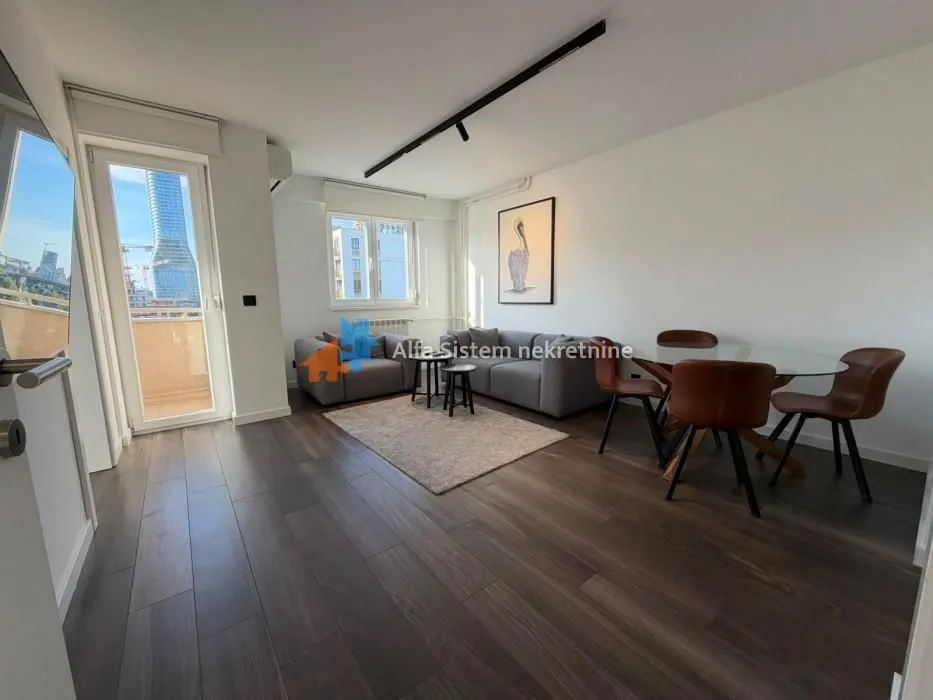 Living room with a sofa set and a dining table.