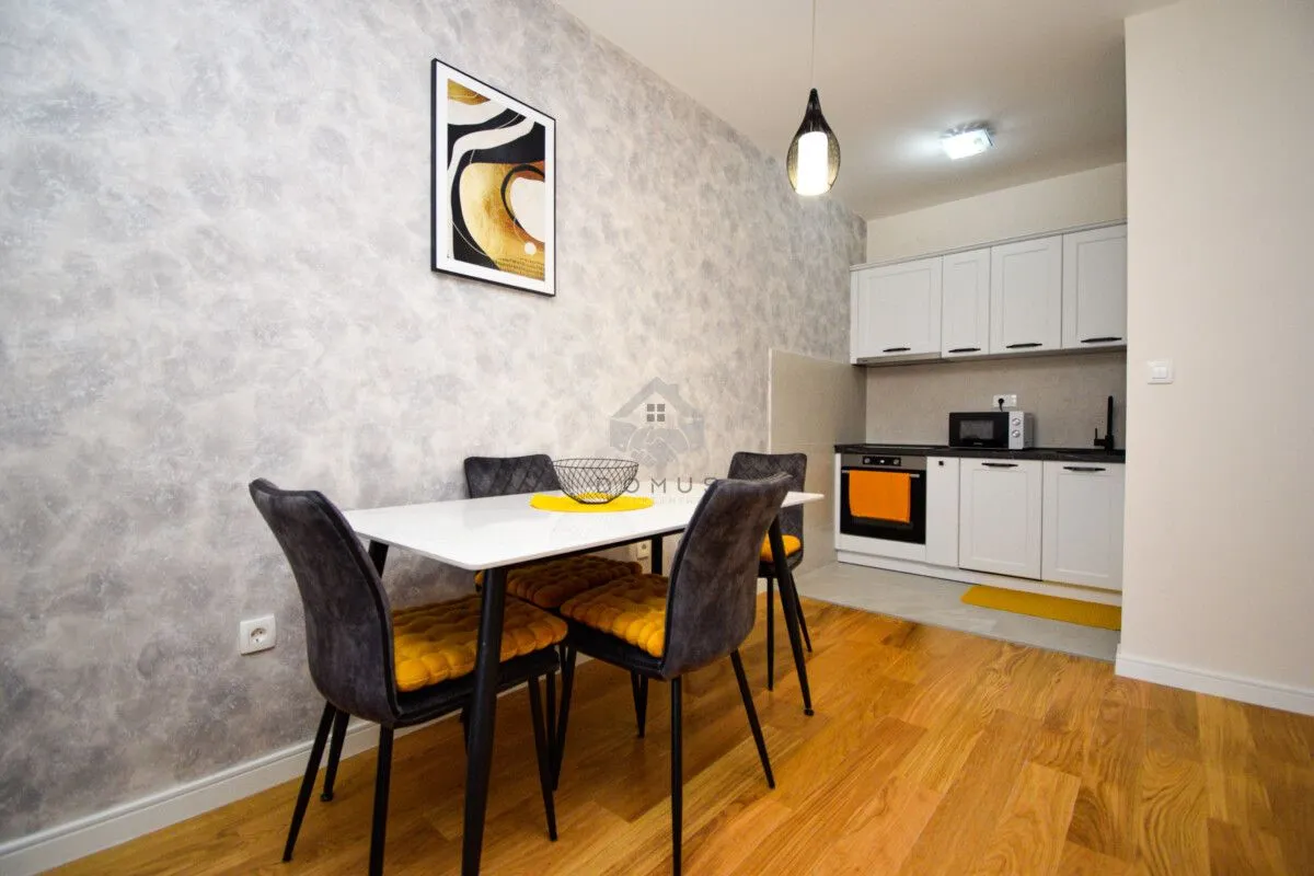 Kitchen with dining area and white cabinets.