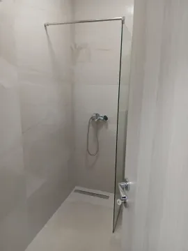 Simple shower with a glass partition in the bathroom. - image 7