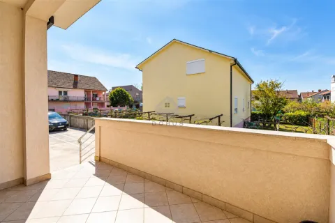 View from the tiled terrace towards the surrounding houses and courtyard. - image 19