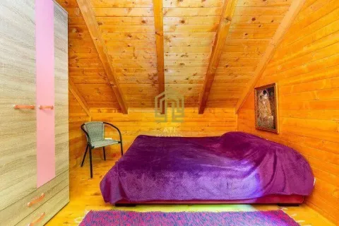 Attic bedroom furnished with wooden wall and ceiling cladding. - image 5
