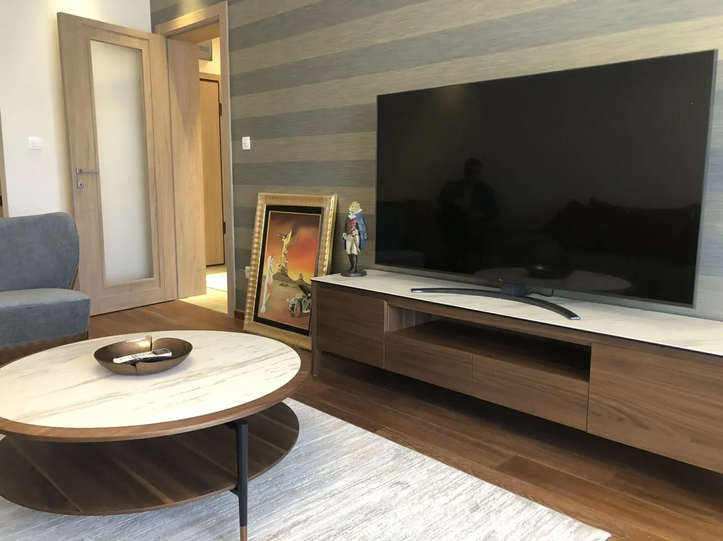 Living room with a TV stand and coffee table.