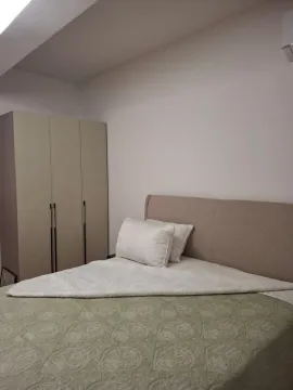 Bedroom with a double bed and a wardrobe. - image 8