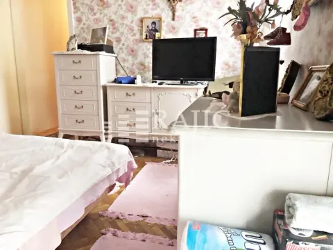 Furnished bedroom with a bed and a dresser. - image 11