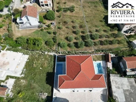 Aerial view of the house with a roof and surrounding area. - image 14