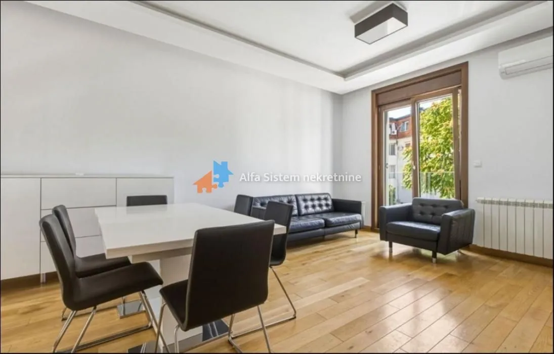 Living room with dining area, sofa set, and access to the terrace.