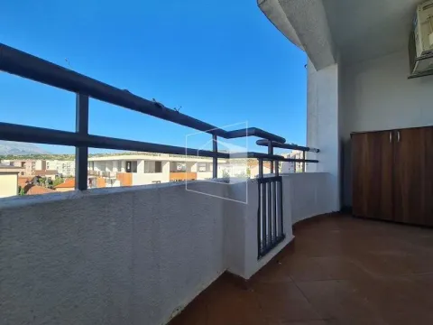 Spacious balcony with a view of the surroundings and a cabinet. - image 5