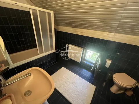 Bathroom with dark tiles, shower cabin, washbasin and toilet. - image 19