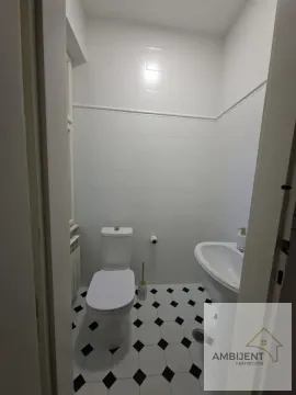Smaller bathroom with white tiles and sanitary ware. - image 11