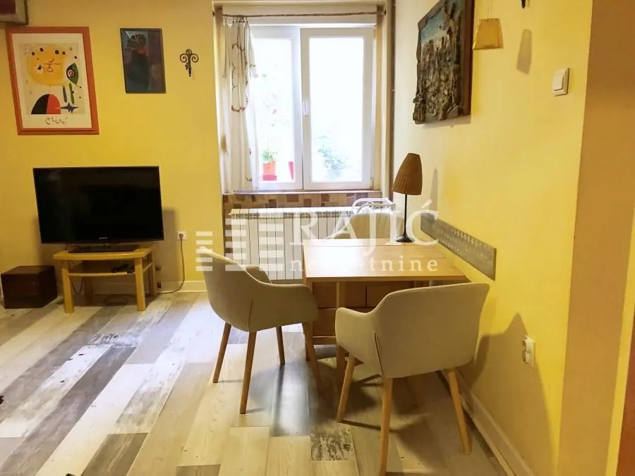 Living room with a dining table and chairs.