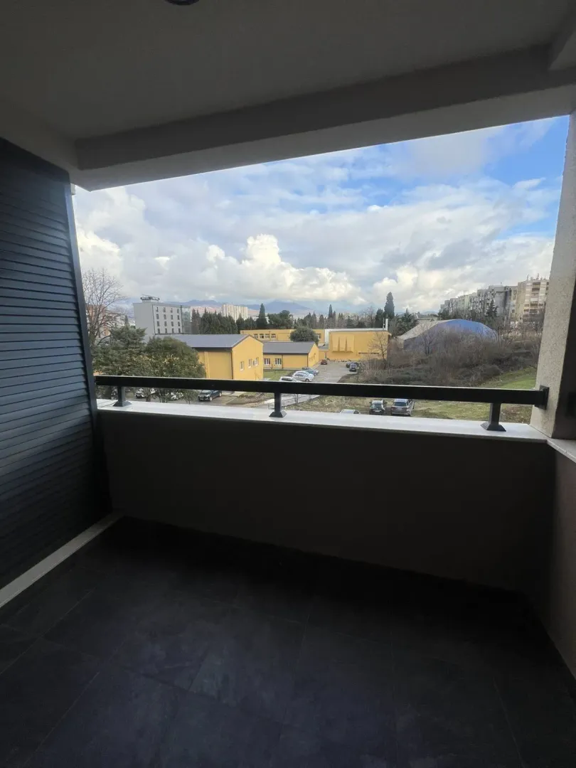 View of the surrounding buildings from a residential balcony.