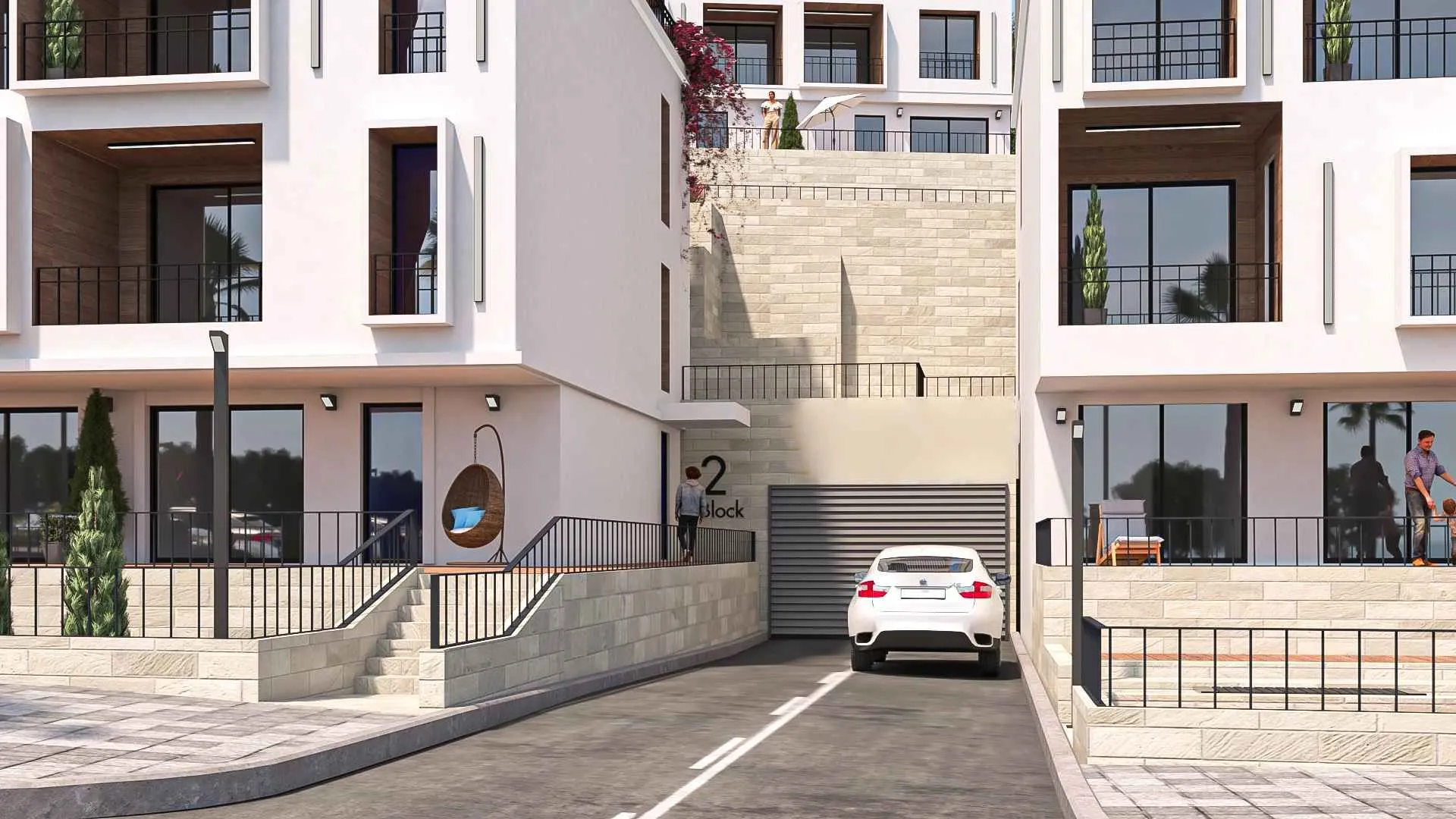 Spoljašnji izgled modernih stambenih zgrada sa uređenim dvorištem i prilazom.
