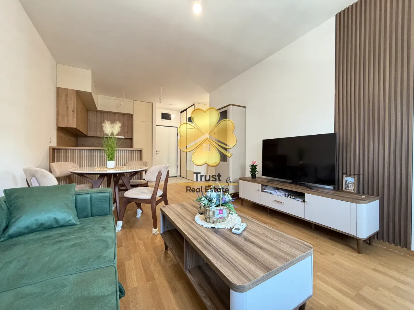 Modern and bright living room connected to the dining area and kitchen.