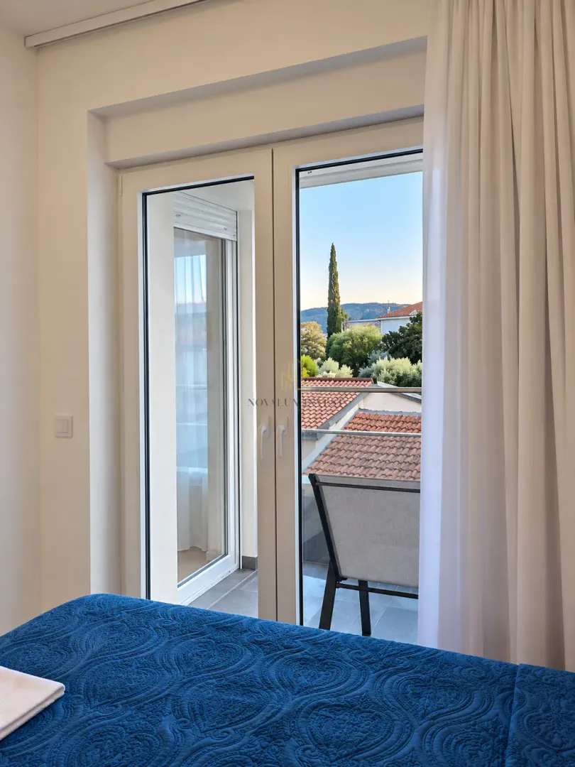 View from the bedroom through the balcony doors to the surroundings.