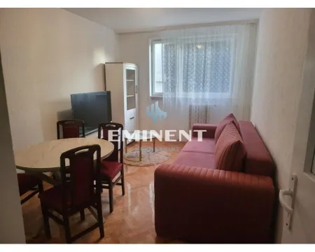 Living room with sofa, dining table and television. - image 2