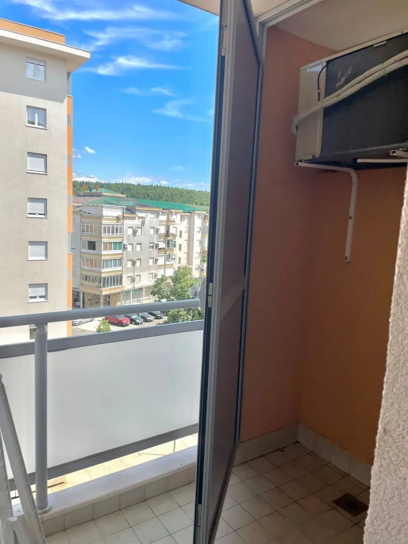 View from the balcony towards surrounding buildings and neighborhood.