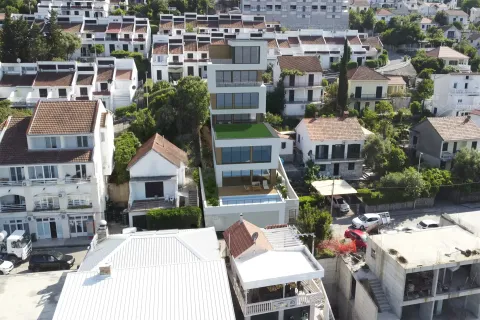 Pogled iz vazduha na modernu stambenu zgradu i okolno naselje. - image 5