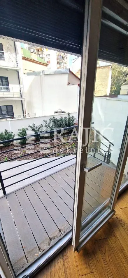 View from the terrace overlooking the courtyard and surrounding buildings.