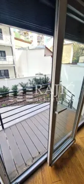 View from the terrace overlooking the courtyard and surrounding buildings. - image 18