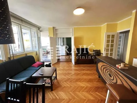 Living room with a sofa, dining table and access to the terrace. - image 9