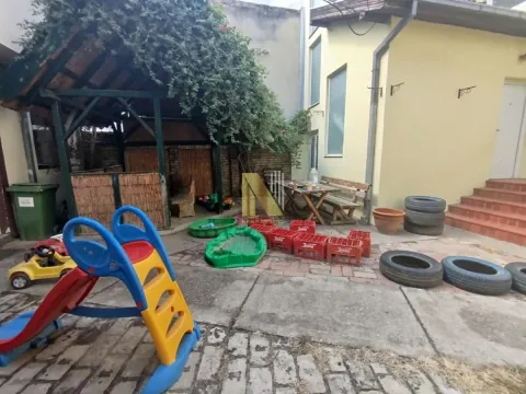 Yard of the house with a gazebo, slide, and clutter. - image 17