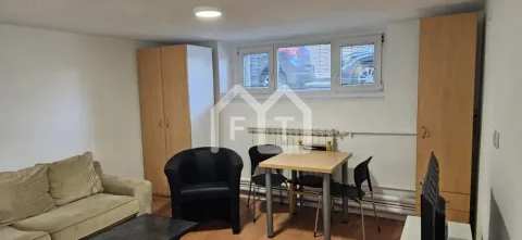 Smaller living room with seating furniture, dining table and wardrobes. - image 3