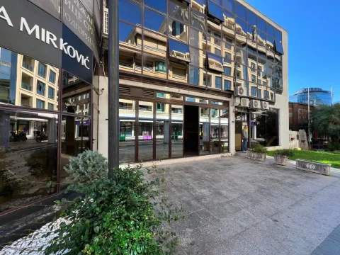 Exterior view of the commercial space with large glass surfaces and an entrance. - image 2