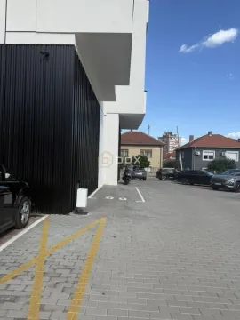 View of the parking area and building exterior. - image 4