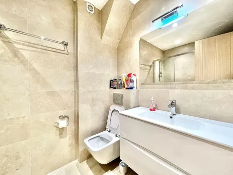 Bright and modern bathroom with a white sink. - image 14