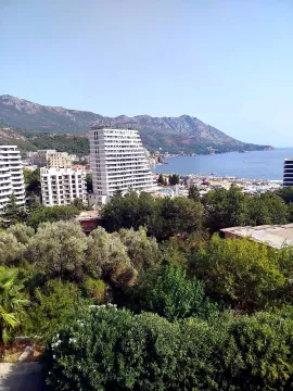 View from the terrace overlooking the city, mountains, and coastline. - image 2