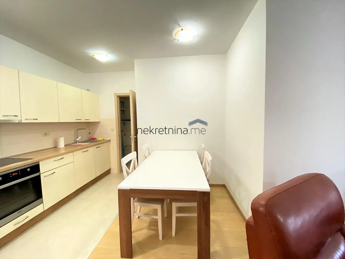 Kitchen with dining area and fitted units.
