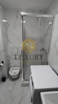 Modernly equipped bathroom with a shower cabin. - image 13