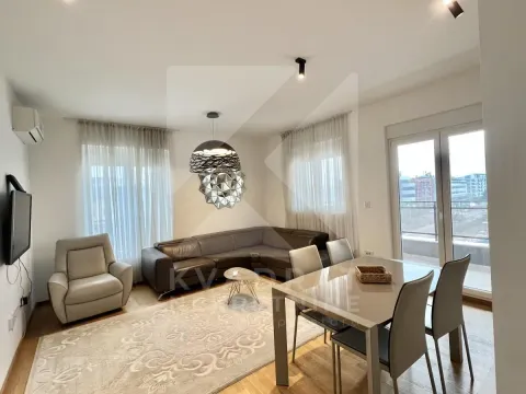 Living room with a sofa set and a dining table. - image 13
