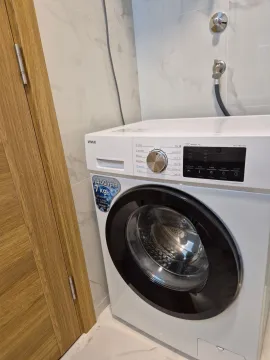 White washing machine in the bathroom. - image 17