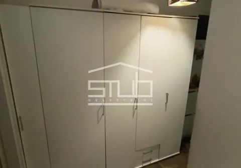 White wardrobe with doors and drawers in the bedroom. - image 15