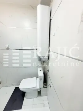 View of the bathroom with sanitary fixtures and a water heater. - image 15