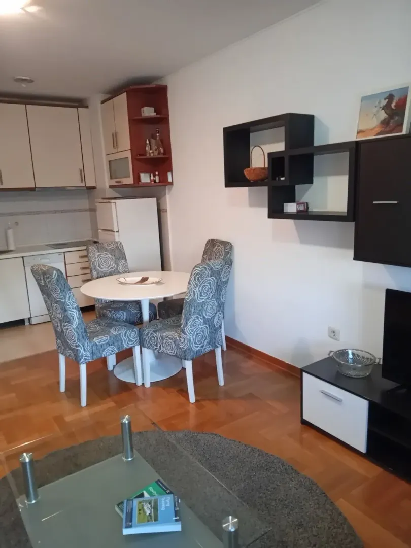 Living room with dining area and kitchen.