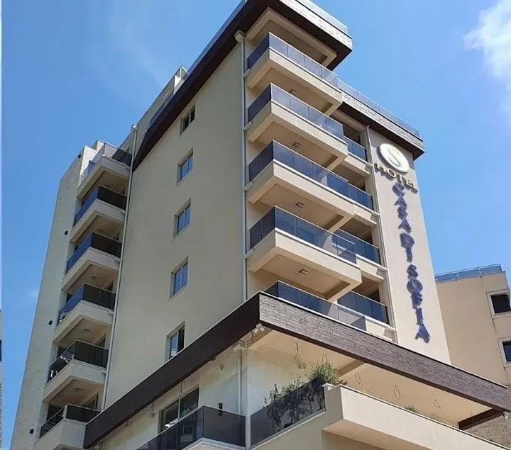 Exterior view of a modern apartment building with balconies.