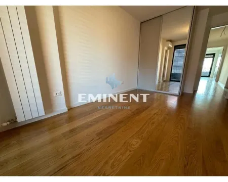 Empty bedroom with wooden flooring and a built-in wardrobe. - image 11