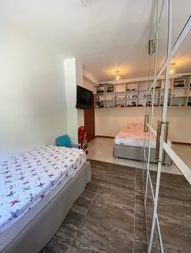 Children's bedroom with two beds and a large mirrored wardrobe. - image 11