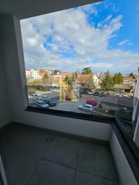 View from the balcony overlooking the neighborhood and parking lot. - image 3