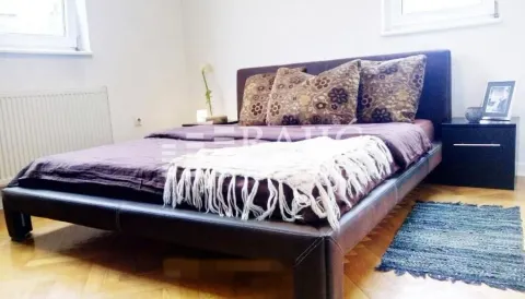 Furnished bedroom with a double bed. - image 4