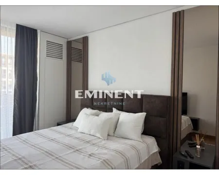 Furnished bedroom with a double bed. - image 13