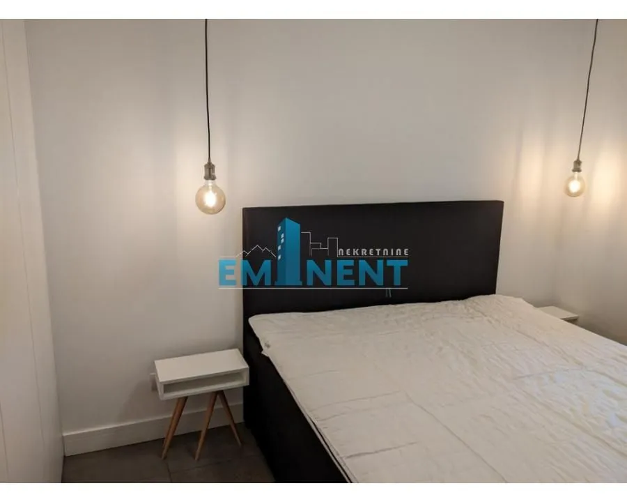 Bedroom with a double bed and bedside tables.
