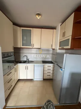 Small kitchen equipped with cabinetry and home appliances. - image 3