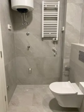 Modernly equipped bathroom with a shower and sanitary fixtures. - image 5